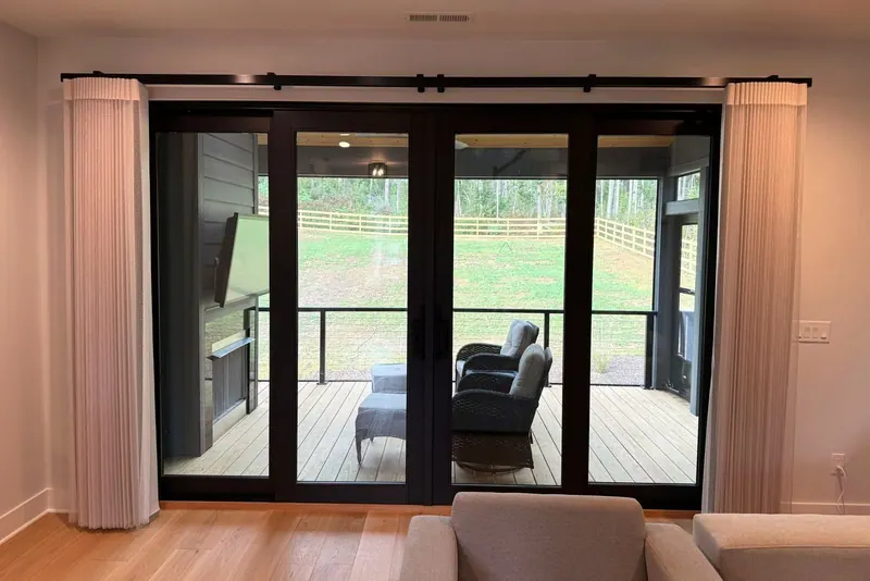 Norman SmartDrape stacked at both sides of a four-panel door to a screened porch