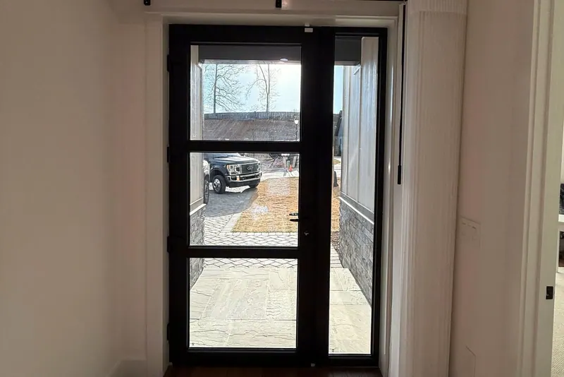 Norman SmartDrape stacked beside a glass entry door