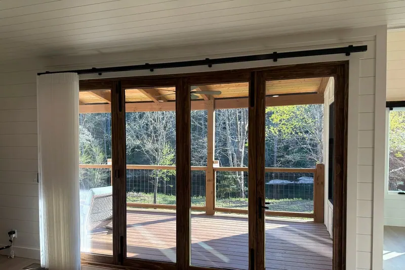 SmartDrape stacked neatly to the left of a four-panel patio door
